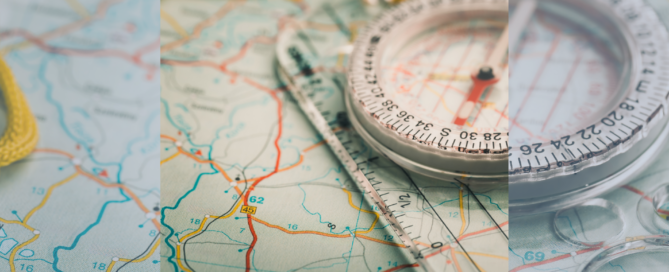 I image of a compass laying on top of a detailed map of the United States.